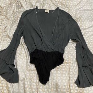 Long sleeved body suit - belled out sleeves